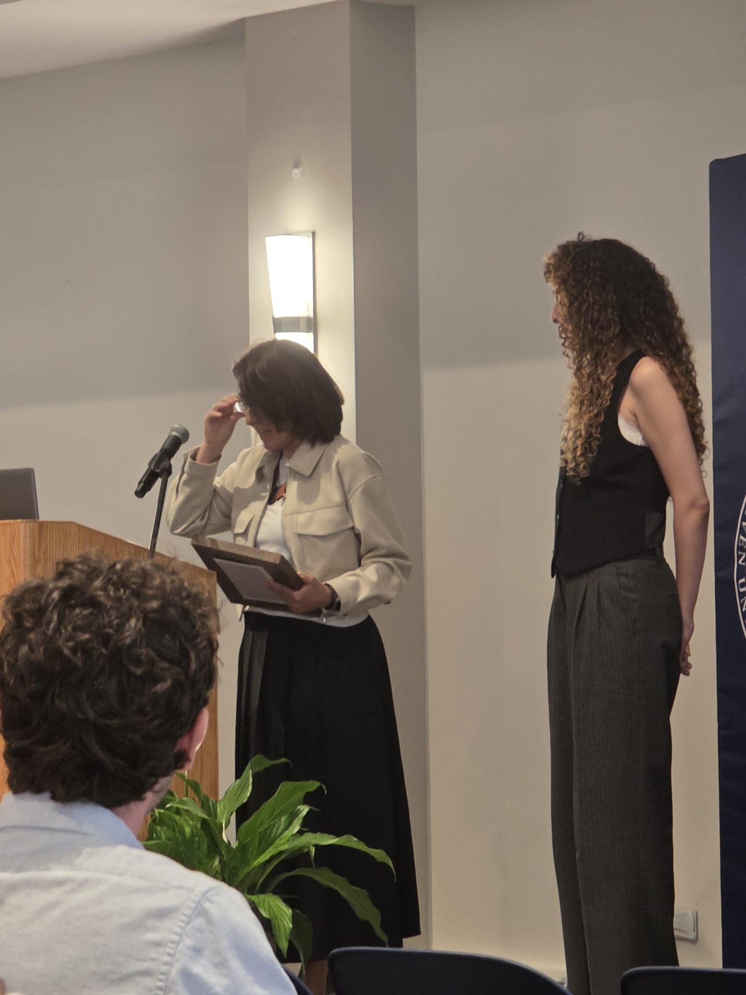 Me on the stage receiving an award at the graduation ceremony
